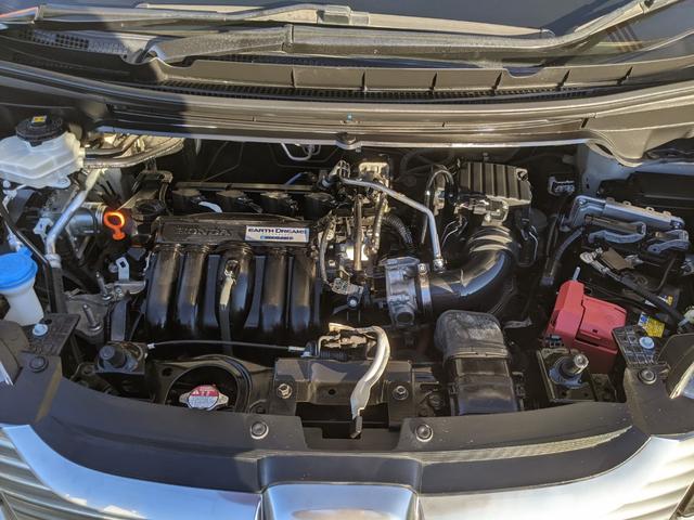 フリードハイブリッド ハイブリッド・EX Bluetooth CD DVD 前席シートヒーター レーダークルコン レーンアシスト ETC 衝突軽減ブレーキ 電動格納ミラー LEDヘッドライト オートライト 純正ナビ 両側パワースライドドア(60枚目)