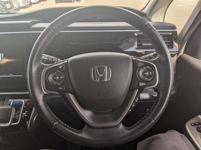 ステップワゴンスパーダ スパーダハイブリッド　Ｇ　ホンダセンシング　両側パワースライドドア　純正９インチインターナビ　フルセグＴＶｂｌｕｅｔｏｏｔｈ　ＣＤ　ＤＶＤ　バックカメラ　フリップダウンモニター　ＬＥＤヘッドライト　レーダークルーズコントロール（11枚目）