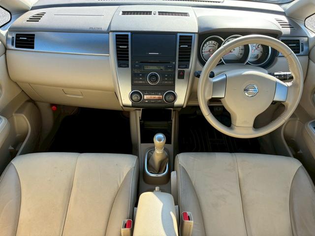 ティーダ １８Ｇ　フォグライト　電動格納ミラー　オートエアコン　半革シート　社外アルミホイール　ＥＴＣ　パワーステアリング　パワーウインドウ（20枚目）