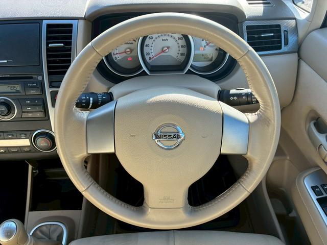 ティーダ １８Ｇ　フォグライト　電動格納ミラー　オートエアコン　半革シート　社外アルミホイール　ＥＴＣ　パワーステアリング　パワーウインドウ（22枚目）