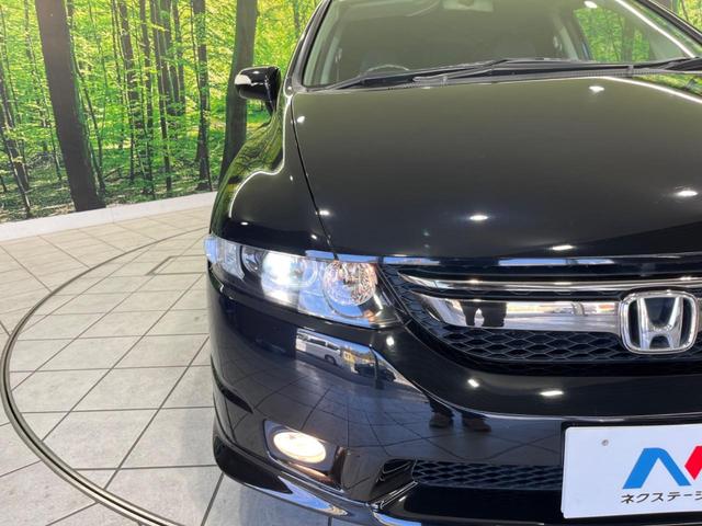 オデッセイ アブソルートＨＤＤナビスペシャルエディション　純正ナビ　バックカメラ　禁煙車　ハーフレザーシート　ＥＴＣ　クルコン　ＨＩＤヘッド　オートライト　オートエアコン　リモコンキー　純正１８インチアルミ　ＣＤ再生　盗難防止システム　電動格納ミラー（30枚目）