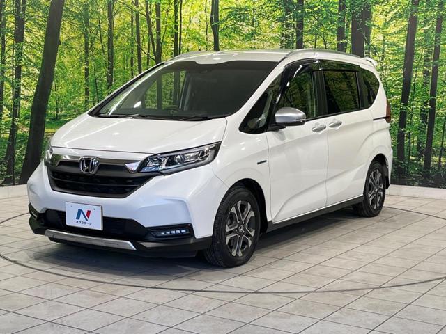 フリード+ハイブリッド ハイブリッド・クロスターホンダセンシング 両側電動ドア 純正9型ナビ バックカメラ ホンダセンシング レーダークルーズ 禁煙車 ハーフレザーシート ドラレコ スマートキー LEDヘッド ETC 純正15インチアルミ Bluetooth再生(21枚目)