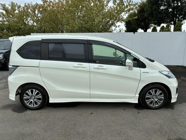 フリードハイブリッド ジャストセレクション ワンオーナー・7インチ純ナビTV・ETC・両パワスラ・スマートキー・HID・オートライト・純AW ナビテレビ セキュリティー 横滑り防止機能 記録簿 オートクルーズ エアバック DVD再生可能 PS(25枚目)