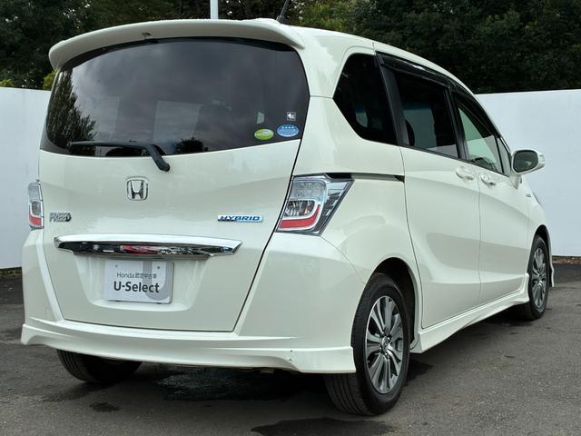 フリードハイブリッド ジャストセレクション ワンオーナー・7インチ純ナビTV・ETC・両パワスラ・スマートキー・HID・オートライト・純AW ナビテレビ セキュリティー 横滑り防止機能 記録簿 オートクルーズ エアバック DVD再生可能 PS(26枚目)