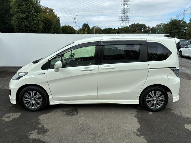 フリードハイブリッド ジャストセレクション ワンオーナー・7インチ純ナビTV・ETC・両パワスラ・スマートキー・HID・オートライト・純AW ナビテレビ セキュリティー 横滑り防止機能 記録簿 オートクルーズ エアバック DVD再生可能 PS(29枚目)