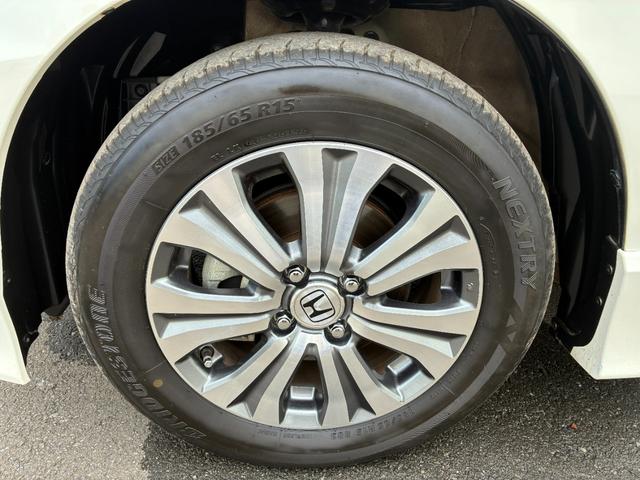 フリードハイブリッド ジャストセレクション ワンオーナー・7インチ純ナビTV・ETC・両パワスラ・スマートキー・HID・オートライト・純AW ナビテレビ セキュリティー 横滑り防止機能 記録簿 オートクルーズ エアバック DVD再生可能 PS(55枚目)