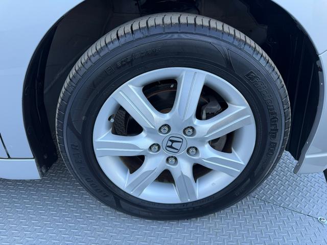 ステップワゴン GLパッケージ ワンオーナー・純ナビ・CD・DVD・左パワスラ・Rカメラ・HID・AW キーレスキー バックモニター パワーウインドウ 盗難防止装置 DVD再生 HDDナビ PS ABS エアバッグ 三列シート(52枚目)