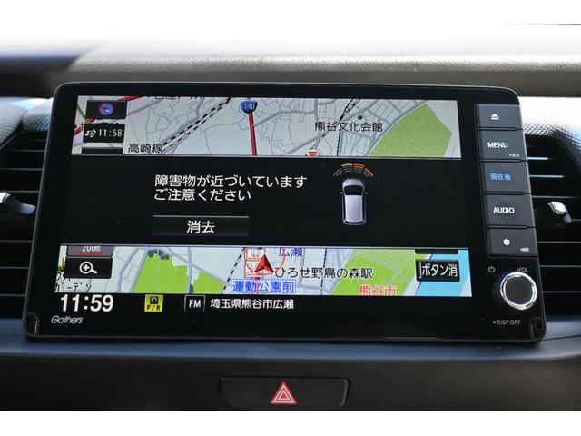 フィット e:HEVネス 雹害現状車 ホンダセンシング 純正9INナビ Rカメラ 2.0ETC FRドラレコ 障害物センサー アルミホイール LEDライト ホンダコネクト 衝突軽減 パーキングセンサー ワンオーナー 地デジ(4枚目)