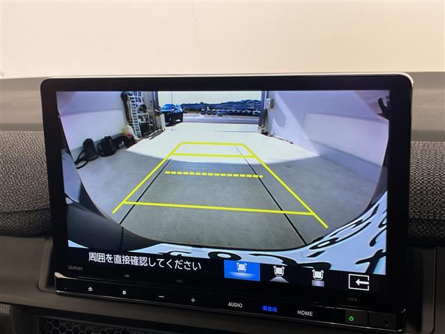 ステップワゴン ｅ：ＨＥＶエアー　ＥＸ　登録済未使用車　純正１１．４型ナビ　１５．６型フリップダウンモニター　両側パワースライドドア　レーダークルーズコントロール　シートヒーター　バックカメラ　電動リアゲート　ブラインドスポットモニター（4枚目）