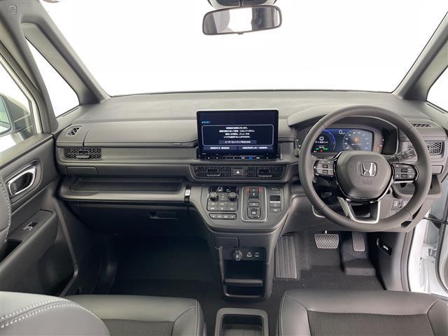 ステップワゴン ｅ：ＨＥＶスパーダ　登録済未使用車　ホンダセンシング　純正１１．４型ナビ　両側パワースライドドア　レーダークルーズコントロール　シートヒーター　バックカメラ　コーナーセンサー　純正アルミホイール　ブラインドスポットモニタ（2枚目）