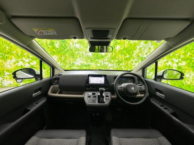 フリード eHEVエアーEX 保証書/純正 9インチ ナビ/ホンダセンシング/両側電動スライドドア/シートヒーター 前席/車線逸脱防止支援システム/パーキングアシスト バックガイド/登録済未使用車 衝突被害軽減システム 禁煙車(4枚目)