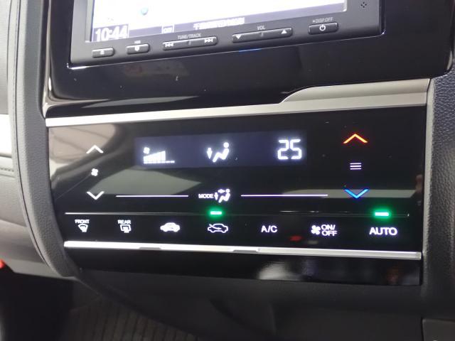 フィットハイブリッド Ｌパッケージ　１オーナ　禁煙　サイドエアバック　ＤＶＤ再生　ＬＥＤ　ＥＣＯＮ　バックカメラ　オートクルーズコントロール　ＥＴＣ　ＥＳＣ　ＡＵＴＯエアコン　ＡＢＳ　運転席助手席エアバッグ　キーフリー（16枚目）