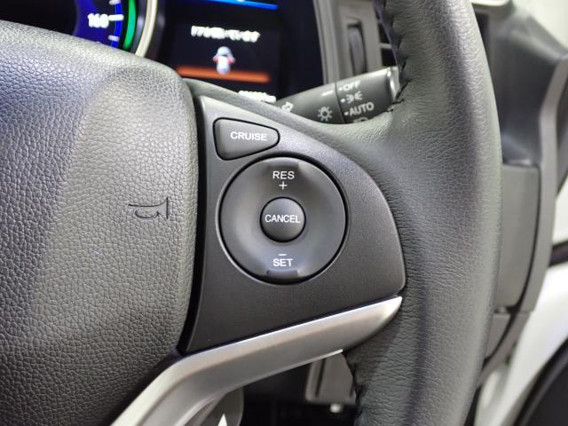 フィットハイブリッド Ｌパッケージ　１オーナ　禁煙　サイドエアバック　ＤＶＤ再生　ＬＥＤ　ＥＣＯＮ　バックカメラ　オートクルーズコントロール　ＥＴＣ　ＥＳＣ　ＡＵＴＯエアコン　ＡＢＳ　運転席助手席エアバッグ　キーフリー（19枚目）