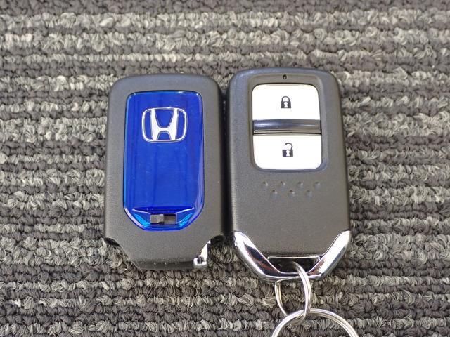 フィットハイブリッド Ｌパッケージ　１オーナ　禁煙　サイドエアバック　ＤＶＤ再生　ＬＥＤ　ＥＣＯＮ　バックカメラ　オートクルーズコントロール　ＥＴＣ　ＥＳＣ　ＡＵＴＯエアコン　ＡＢＳ　運転席助手席エアバッグ　キーフリー（24枚目）