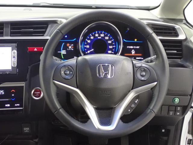 フィットハイブリッド Ｌパッケージ　１オーナ　禁煙　サイドエアバック　ＤＶＤ再生　ＬＥＤ　ＥＣＯＮ　バックカメラ　オートクルーズコントロール　ＥＴＣ　ＥＳＣ　ＡＵＴＯエアコン　ＡＢＳ　運転席助手席エアバッグ　キーフリー（28枚目）