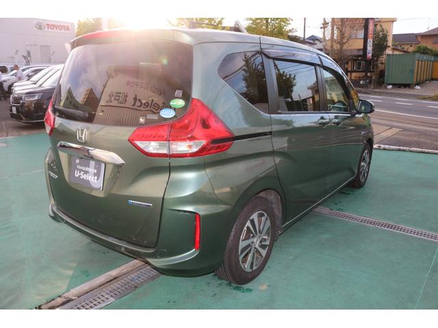 フリードハイブリッド ハイブリッド・Ｇホンダセンシング　軽減ブレーキ　キーフリーシステム　電動格納式ドアミラー　衝突安全ボディ　１オ－ナ－　記録簿　ＤＶＤ再生可能　サイドカーテンエアバック　後カメラ　Ａクルーズ　横滑防止（7枚目）