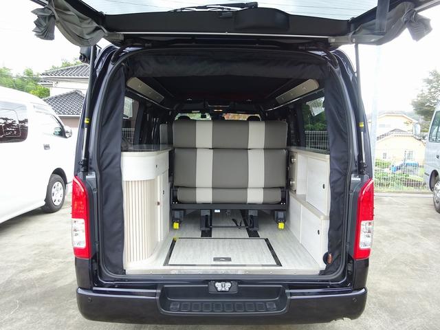 ハイエースバン キャンピングカー ケイワークス オーロラスタークルーズSL バンコン シンク エバスペヒャー製FFヒーター シングルサブ 1500Wインバーター フレキシブルソーラー サイドオーニング 電子レンジ 給排水19L フリップダウンモニター ポップアップ TSS(6枚目)