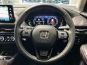 ｅ：ＨＥＶ　Ｚ　ホンダセンシング／純正ナビ（ＨＯＮＤＡ　ＣＯＮＮＥＣＴ）全方位カメラ／純正ビルドインＥＴＣ／純正ドライブレコーダー（前後）／電動リアゲート／ハンズフリーアクセスパワーテールゲート／革巻きステアリング（22枚目）
