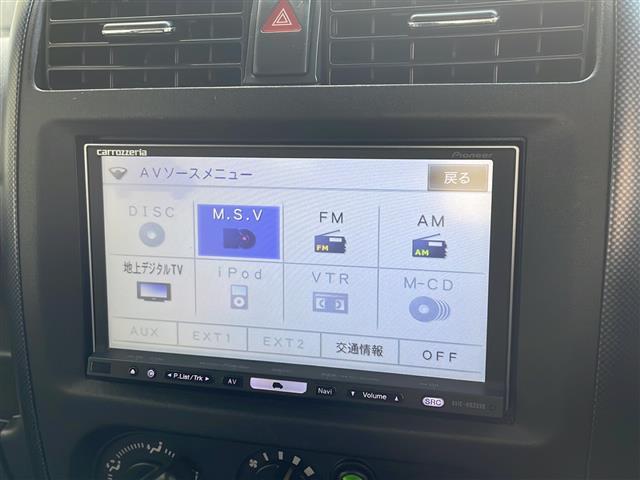 ジムニー ワイルドウインド ロッソモデロマフラー・社外ナビ・ターボ・4WD・前後ドラレコ・ETC・シートヒーター・背面タイヤ(3枚目)