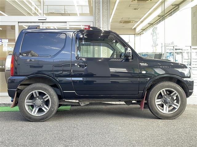 ジムニー ワイルドウインド ロッソモデロマフラー・社外ナビ・ターボ・4WD・前後ドラレコ・ETC・シートヒーター・背面タイヤ(26枚目)