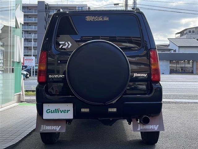 ジムニー ワイルドウインド ロッソモデロマフラー・社外ナビ・ターボ・4WD・前後ドラレコ・ETC・シートヒーター・背面タイヤ(28枚目)