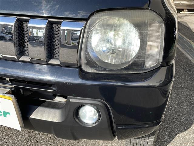 ジムニー ワイルドウインド ロッソモデロマフラー・社外ナビ・ターボ・4WD・前後ドラレコ・ETC・シートヒーター・背面タイヤ(31枚目)