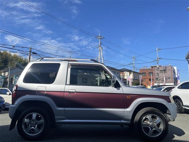 パジェロミニ エクシード SDナビ/ワンセグテレビ/CD/DVD/ETC/純正15インチアルミホイール/背面タイヤ/ルーフレール/ターボ/4WD/フロアマット/フォグライト/ドアバイザー/キーレス/スペアキー/フルフラット(7枚目)