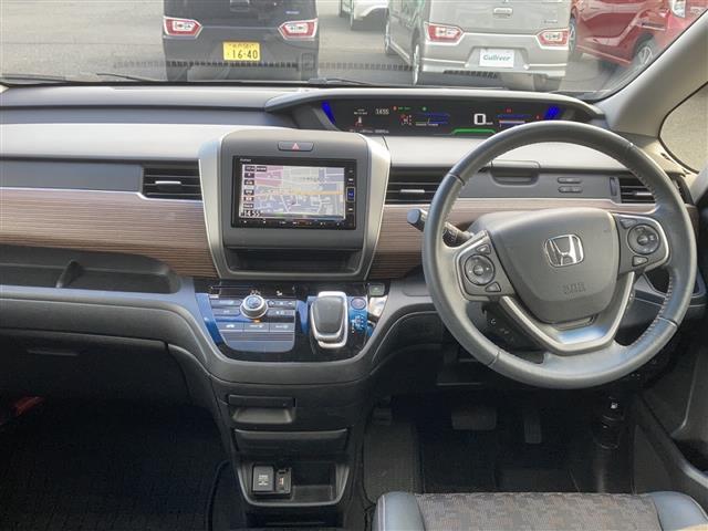 フリードハイブリッド ハイブリッド・クロスターホンダセンシング　☆ワンオーナー☆純正メモリナビ【フルセグ・ＤＶＤ再生可・ＣＤ・Ｂｌｕｅｔｏｏｔｈ】☆バックカメラ☆ビルトインＥＴＣ☆両側パワースライドドア☆ホンダセンシング【衝突軽減ブレーキ・前後誤発進（6枚目）