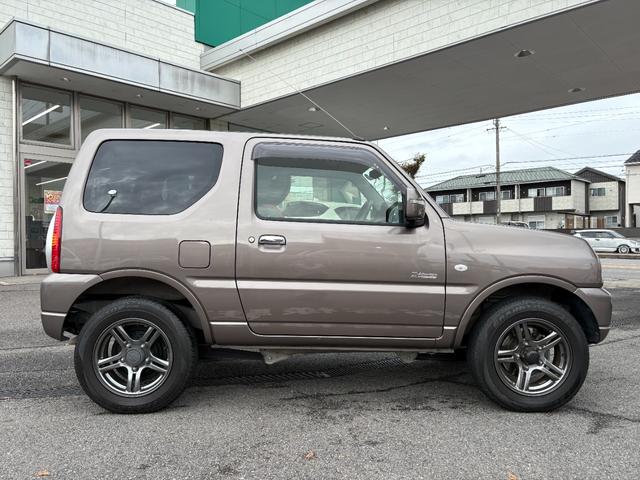 ジムニー クロスアドベンチャー　禁煙　パートタイム４ＷＤ　背面タイヤ　ＥＴＣ　ナビ　地デジＴＶ　ＤＶＤ　ＵＳＢ　シートヒーター　ハーフレザーシート　純正フロアマット　純正アルミホイール　ドアバイザー　フォグランプ　保証書　取扱説明書（44枚目）