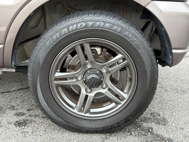 ジムニー クロスアドベンチャー　禁煙　パートタイム４ＷＤ　背面タイヤ　ＥＴＣ　ナビ　地デジＴＶ　ＤＶＤ　ＵＳＢ　シートヒーター　ハーフレザーシート　純正フロアマット　純正アルミホイール　ドアバイザー　フォグランプ　保証書　取扱説明書（55枚目）