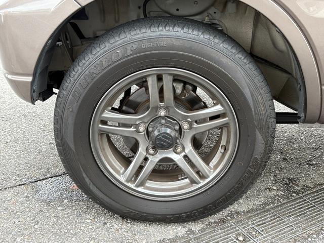 ジムニー クロスアドベンチャー　禁煙　パートタイム４ＷＤ　背面タイヤ　ＥＴＣ　ナビ　地デジＴＶ　ＤＶＤ　ＵＳＢ　シートヒーター　ハーフレザーシート　純正フロアマット　純正アルミホイール　ドアバイザー　フォグランプ　保証書　取扱説明書（56枚目）