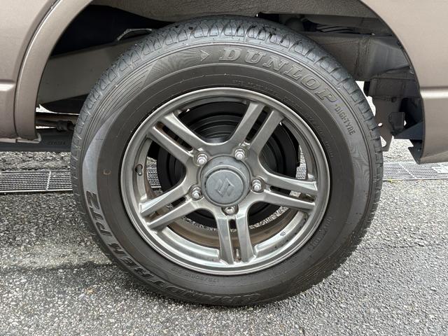 ジムニー クロスアドベンチャー　禁煙　パートタイム４ＷＤ　背面タイヤ　ＥＴＣ　ナビ　地デジＴＶ　ＤＶＤ　ＵＳＢ　シートヒーター　ハーフレザーシート　純正フロアマット　純正アルミホイール　ドアバイザー　フォグランプ　保証書　取扱説明書（57枚目）