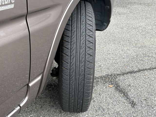 ジムニー クロスアドベンチャー　禁煙　パートタイム４ＷＤ　背面タイヤ　ＥＴＣ　ナビ　地デジＴＶ　ＤＶＤ　ＵＳＢ　シートヒーター　ハーフレザーシート　純正フロアマット　純正アルミホイール　ドアバイザー　フォグランプ　保証書　取扱説明書（58枚目）