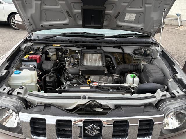 ジムニー クロスアドベンチャー　禁煙　パートタイム４ＷＤ　背面タイヤ　ＥＴＣ　ナビ　地デジＴＶ　ＤＶＤ　ＵＳＢ　シートヒーター　ハーフレザーシート　純正フロアマット　純正アルミホイール　ドアバイザー　フォグランプ　保証書　取扱説明書（61枚目）