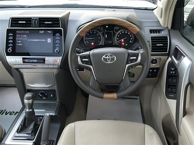 ランドクルーザープラド TX Lパッケージ マットブラックエディション ワンオーナー サンルーフ モデリスタエアロ メーカーナビ 全方位カメラ ルーフレール 純正18インチアルミ トヨタセーフティーセンス 盗難防止装置 横滑り防止装置 電格サードシート 新車時保証書 取説(12枚目)