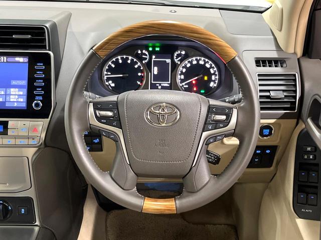 ランドクルーザープラド TX Lパッケージ マットブラックエディション サンルーフ メーカーナビ 全周囲カメラ 7人 ブラインドスポットモニター 純正サイドステップ 寒冷地仕様 禁煙車 ベージュ革シート レーダークルーズ シートベンチレーション セーフティセンス ETC(13枚目)