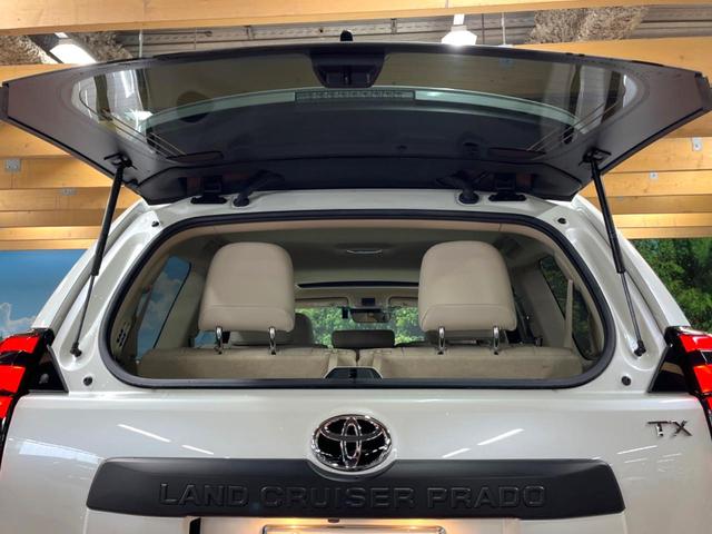 ランドクルーザープラド TX Lパッケージ マットブラックエディション サンルーフ メーカーナビ 全周囲カメラ 7人 ブラインドスポットモニター 純正サイドステップ 寒冷地仕様 禁煙車 ベージュ革シート レーダークルーズ シートベンチレーション セーフティセンス ETC(28枚目)