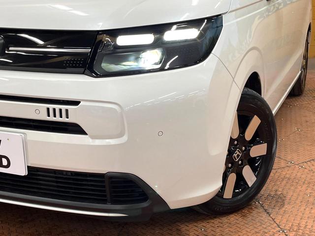 フリード e:HEVエアー EX 登録済未使用車 11型ナビ 両側電動ドア 後席ウォークスルー ブラインドスポットモニター シートヒーター レーダークルーズ バックカメラ 純正15インチアルミ LEDヘッド クリアランスソナー(14枚目)