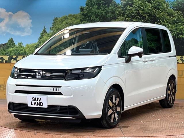 フリード e:HEVエアー EX 登録済未使用車 11型ナビ 両側電動ドア 後席ウォークスルー ブラインドスポットモニター シートヒーター レーダークルーズ バックカメラ 純正15インチアルミ LEDヘッド クリアランスソナー(53枚目)