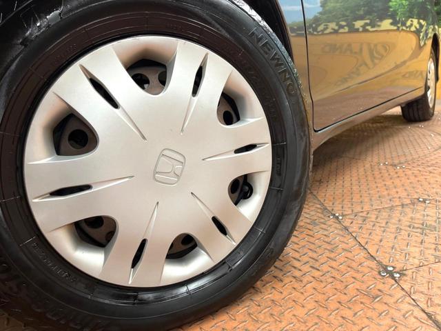 フリード Ｇ　ジャストセレクション　禁煙車　電動スライドドア　ウォークスルー　ＨＩＤヘッド　オートエアコン　ＣＤ　衝突安全ボディ　オートライト　電動格納ミラー（12枚目）