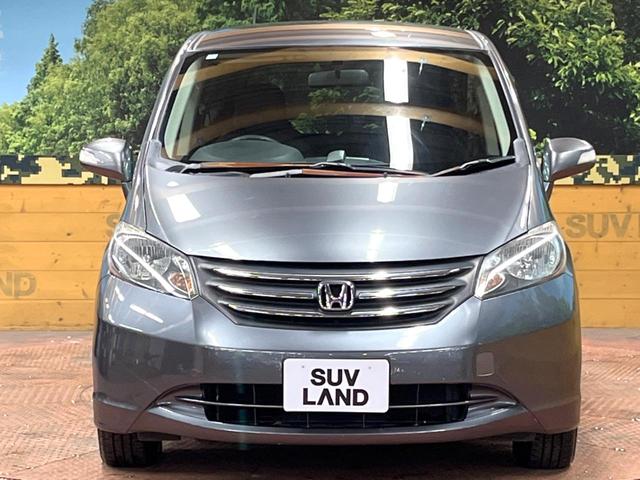 フリード Ｇ　ジャストセレクション　禁煙車　電動スライドドア　ウォークスルー　ＨＩＤヘッド　オートエアコン　ＣＤ　衝突安全ボディ　オートライト　電動格納ミラー（13枚目）