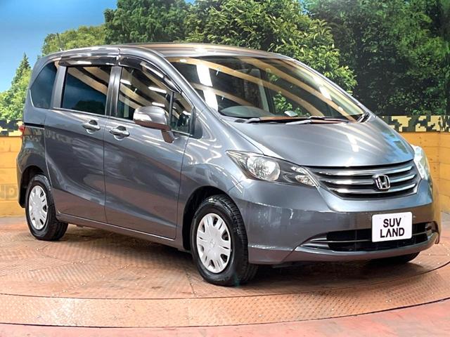 フリード Ｇ　ジャストセレクション　禁煙車　電動スライドドア　ウォークスルー　ＨＩＤヘッド　オートエアコン　ＣＤ　衝突安全ボディ　オートライト　電動格納ミラー（15枚目）