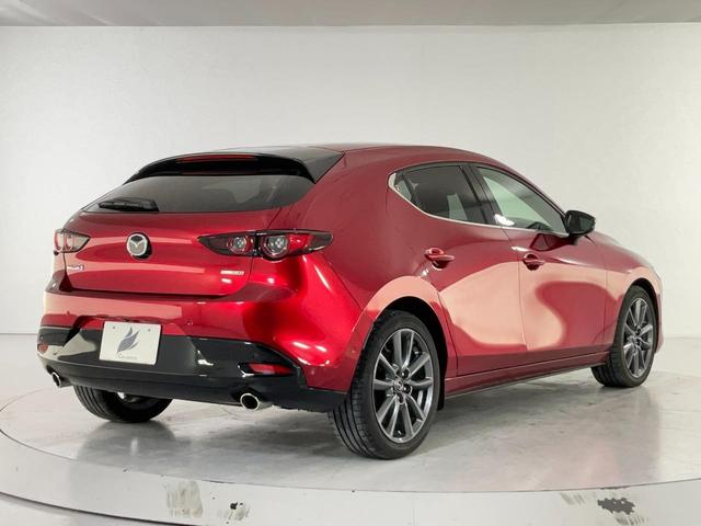 MAZDA3ファストバック 20Sバーガンディ セレクション BOSE/赤革/マツコネ/ETC/純正前後ドラレコ/バックカメラ/衝突軽減/追従クルコン/誤発進抑制/LKAS/BSM/接近車両検知/アダプティブLEDヘッド/運転席パワーシート/前席シートヒーター(6枚目)