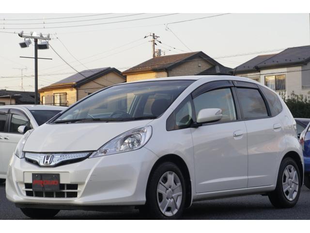 フィットハイブリッド スマートセレクション　１年保証付　純正ＨＤＤナビ　ワンセグＴＶ　バックカメラ　ＣＤ・ＤＶＤ再生　ステアリングスイッチ　ＨＩＤヘッドライト　オートライト　スマートキー　クルーズコントロール　オートエアコン　電動格納ミラー（5枚目）