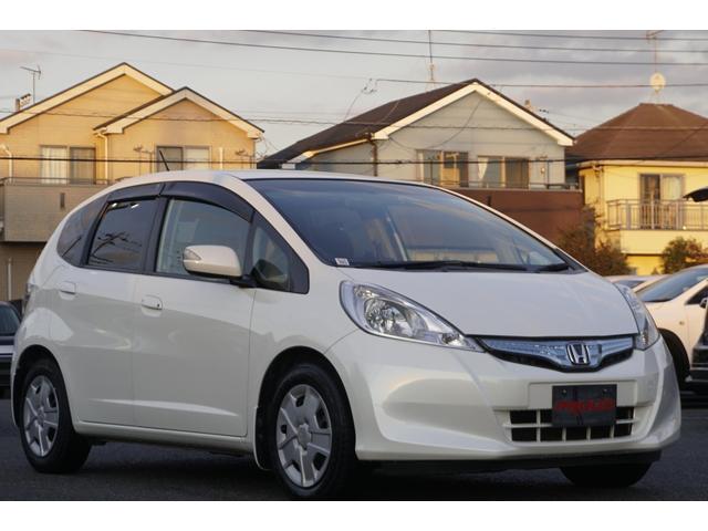 フィットハイブリッド スマートセレクション　１年保証付　純正ＨＤＤナビ　ワンセグＴＶ　バックカメラ　ＣＤ・ＤＶＤ再生　ステアリングスイッチ　ＨＩＤヘッドライト　オートライト　スマートキー　クルーズコントロール　オートエアコン　電動格納ミラー（7枚目）