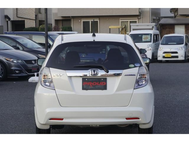 フィットハイブリッド スマートセレクション　１年保証付　純正ＨＤＤナビ　ワンセグＴＶ　バックカメラ　ＣＤ・ＤＶＤ再生　ステアリングスイッチ　ＨＩＤヘッドライト　オートライト　スマートキー　クルーズコントロール　オートエアコン　電動格納ミラー（10枚目）