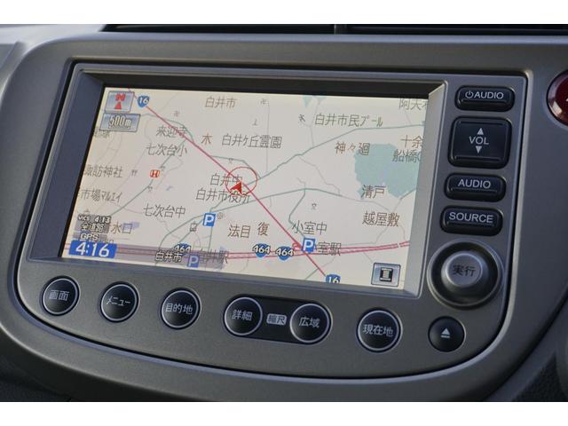 フィットハイブリッド スマートセレクション　１年保証付　純正ＨＤＤナビ　ワンセグＴＶ　バックカメラ　ＣＤ・ＤＶＤ再生　ステアリングスイッチ　ＨＩＤヘッドライト　オートライト　スマートキー　クルーズコントロール　オートエアコン　電動格納ミラー（16枚目）