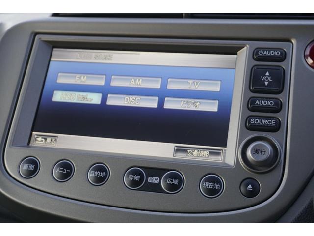 フィットハイブリッド スマートセレクション　１年保証付　純正ＨＤＤナビ　ワンセグＴＶ　バックカメラ　ＣＤ・ＤＶＤ再生　ステアリングスイッチ　ＨＩＤヘッドライト　オートライト　スマートキー　クルーズコントロール　オートエアコン　電動格納ミラー（18枚目）