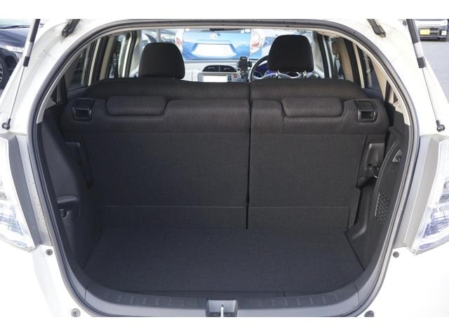 フィットハイブリッド スマートセレクション　１年保証付　純正ＨＤＤナビ　ワンセグＴＶ　バックカメラ　ＣＤ・ＤＶＤ再生　ステアリングスイッチ　ＨＩＤヘッドライト　オートライト　スマートキー　クルーズコントロール　オートエアコン　電動格納ミラー（34枚目）