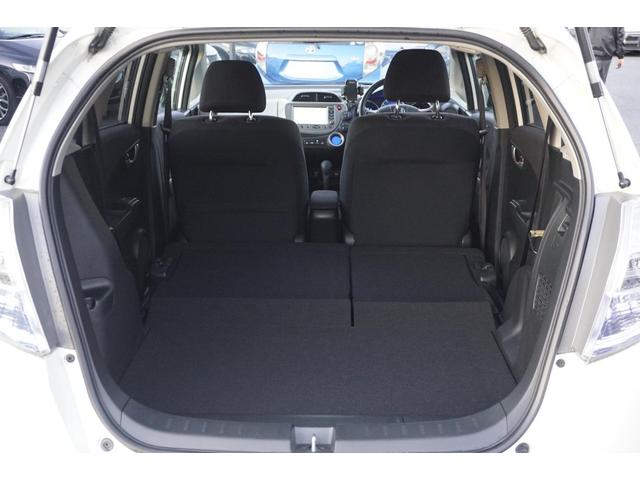 フィットハイブリッド スマートセレクション　１年保証付　純正ＨＤＤナビ　ワンセグＴＶ　バックカメラ　ＣＤ・ＤＶＤ再生　ステアリングスイッチ　ＨＩＤヘッドライト　オートライト　スマートキー　クルーズコントロール　オートエアコン　電動格納ミラー（35枚目）